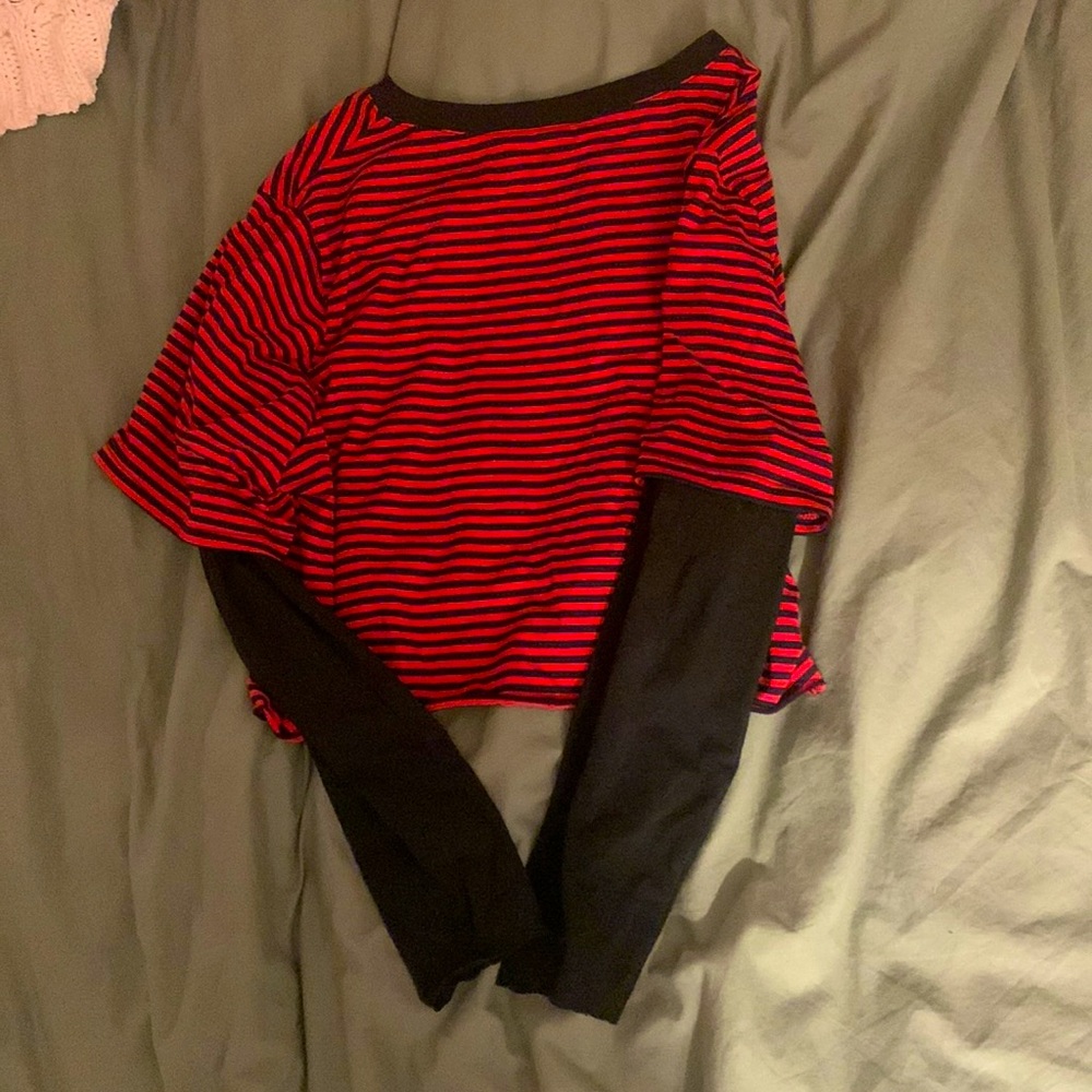 Red and black stripped shirt with black long sleeves underneath